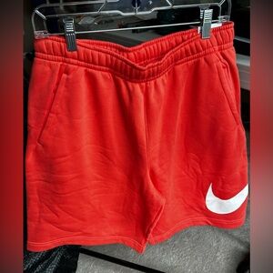 Men’s Nike shorts, picture darker orange than actual color,more like salmon